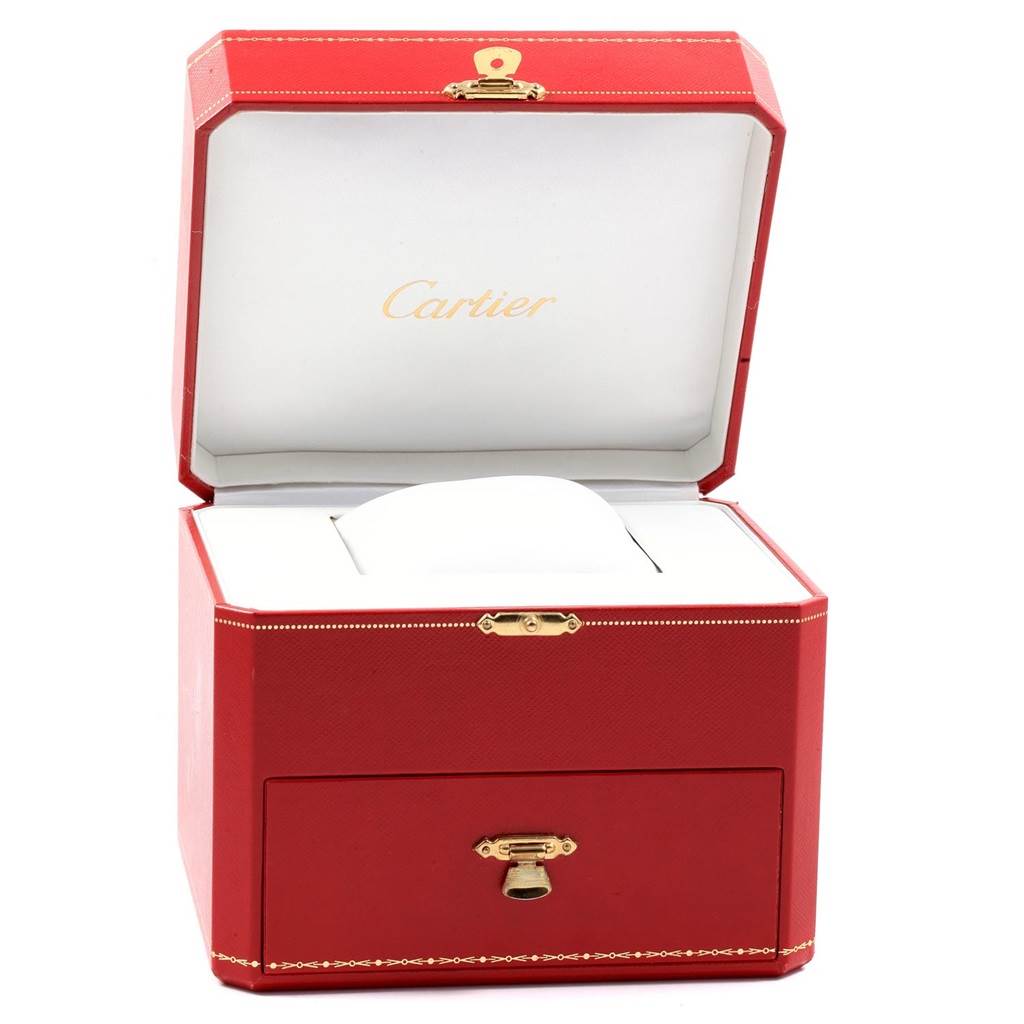 This image shows an open red Cartier watch box for the Roadster model, highlighting its interior and cushion.