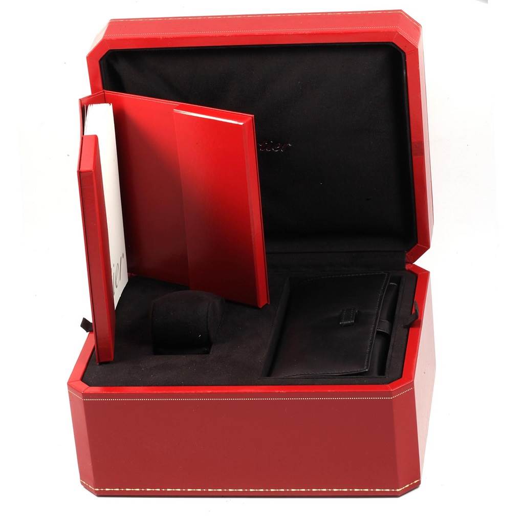 The image shows an open red box with compartments for a Cartier Roadster W62019X6 Men
s Stainless Steel Silver Dial W62019X6 Men
s Stainless Steel Silver Dial model watch and its accessories.