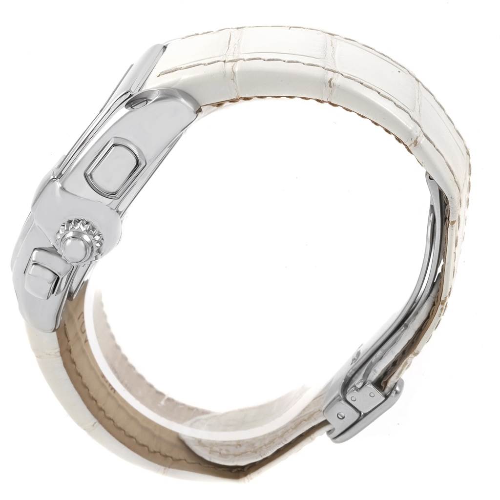 This is a side view of a Cartier Roadster W62019X6 Men
s Stainless Steel Silver Dial W62019X6 Men
s Stainless Steel Silver Dial watch, showcasing its crown and part of its white leather strap.