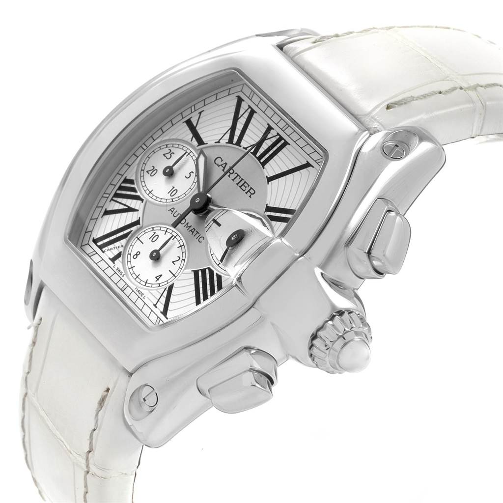 The Cartier Roadster W62019X6 Men
s Stainless Steel Silver Dial W62019X6 Men
s Stainless Steel Silver Dial watch is shown at a tilted angle, highlighting the dial, crown, and a portion of the strap.