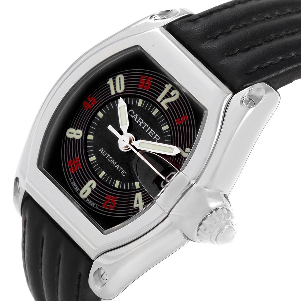 This image shows a Cartier Roadster W62002V3 Men
s Stainless Steel Black Dial W62002V3 Men
s Stainless Steel Black Dial watch from an angled view, highlighting the face, crown, and part of the leather strap.