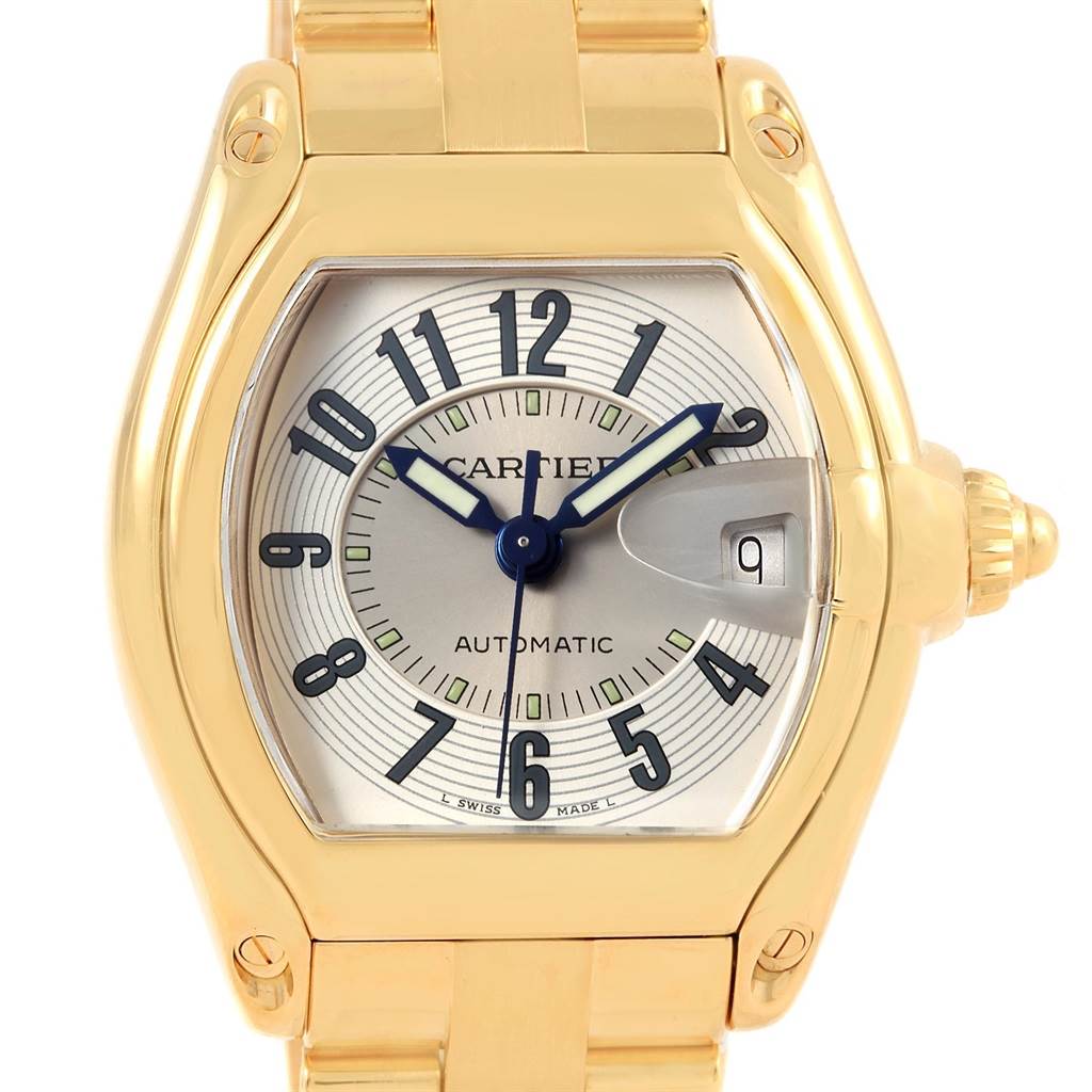 This image shows a front view of the Cartier Roadster W62005V1 Men's Yellow Gold Silver Dial W62005V1 Men's Yellow Gold Silver Dial watch, highlighting its gold case and bracelet, dial, and calendar feature.