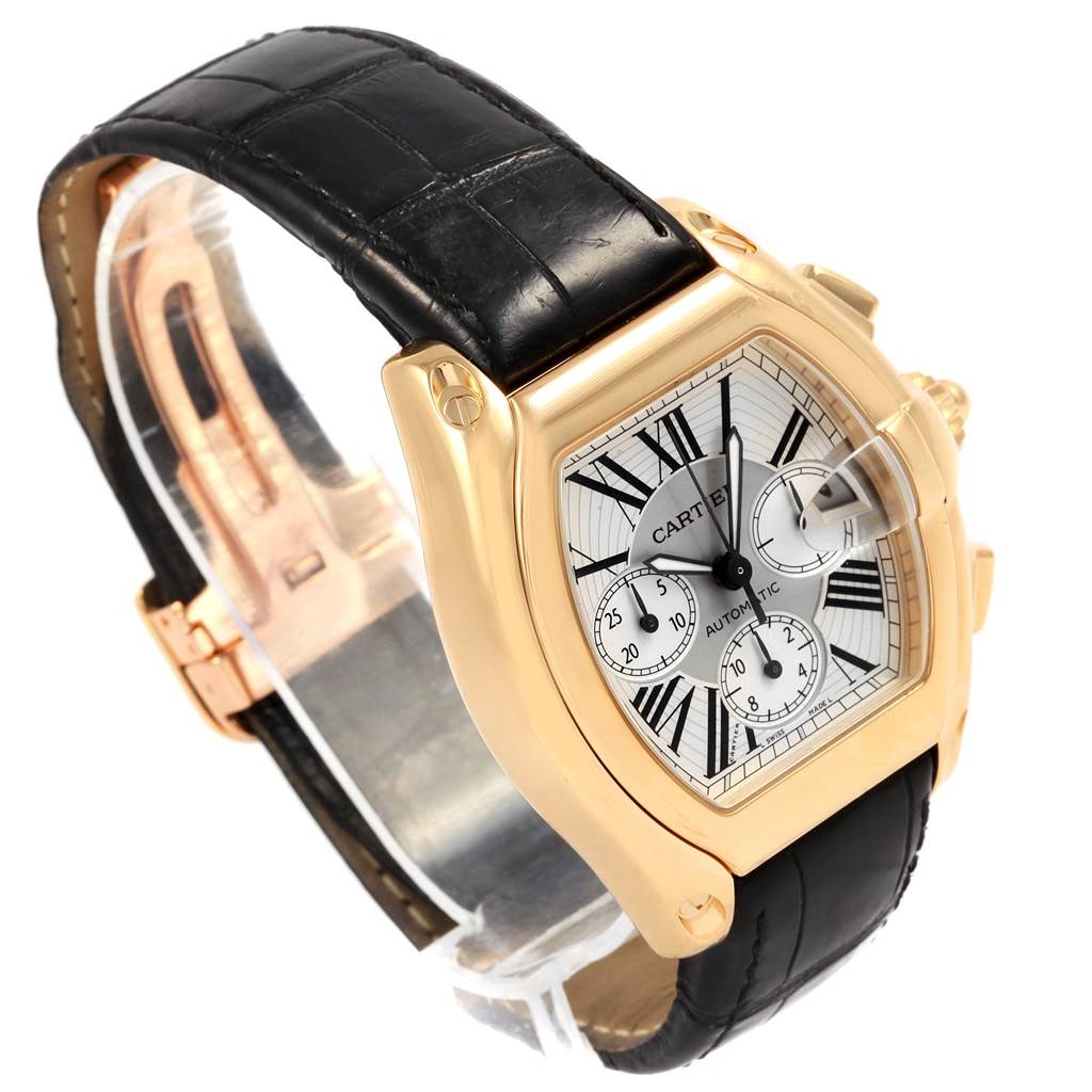 The Cartier Roadster W62021Y3 Men's Yellow Gold Silver Dial W62021Y3 Men's Yellow Gold Silver Dial watch is shown at an angled view highlighting the face, black leather strap, and gold casing.