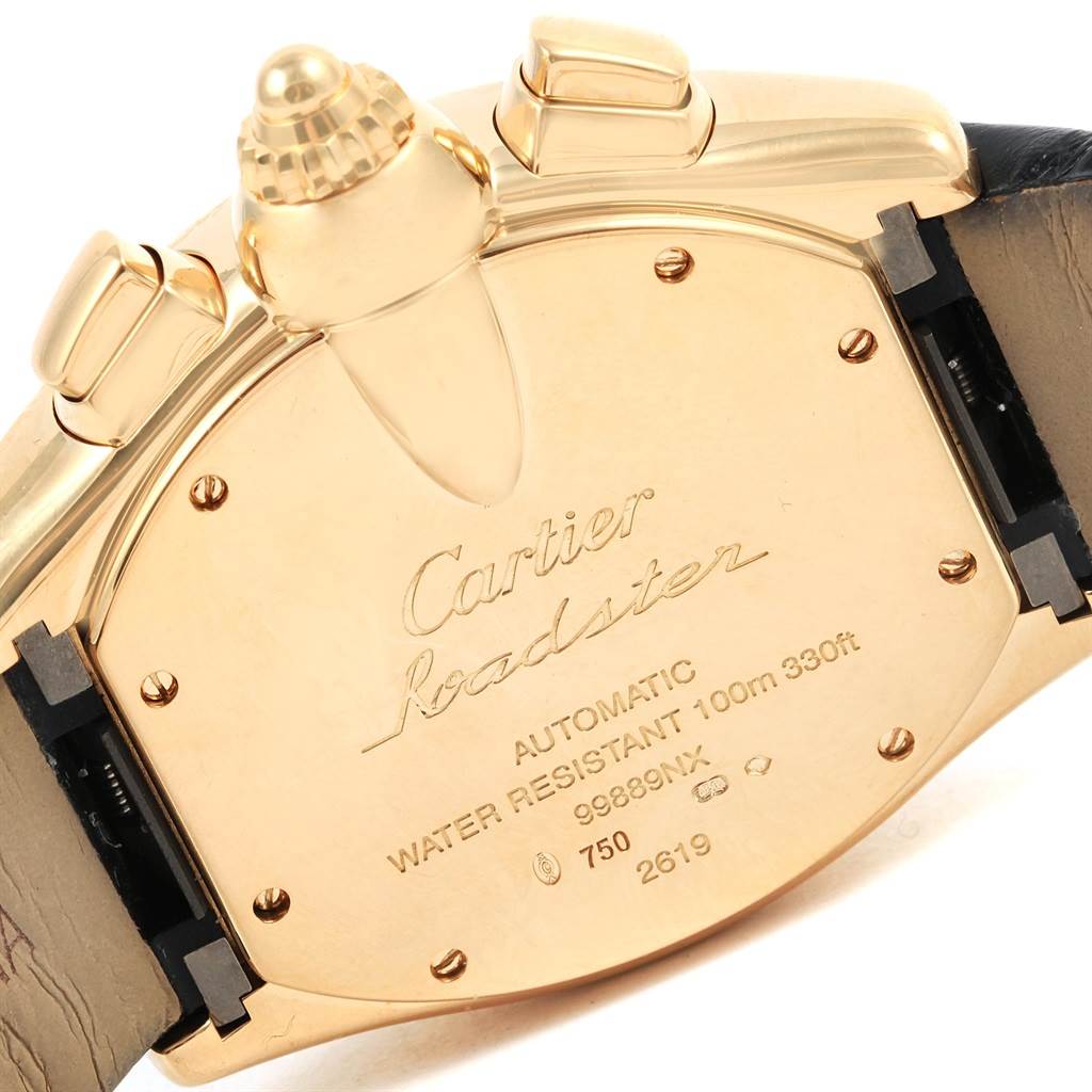 The image shows the back case and crown of a Cartier Roadster W62021Y3 Men's Yellow Gold Silver Dial W62021Y3 Men's Yellow Gold Silver Dial watch.