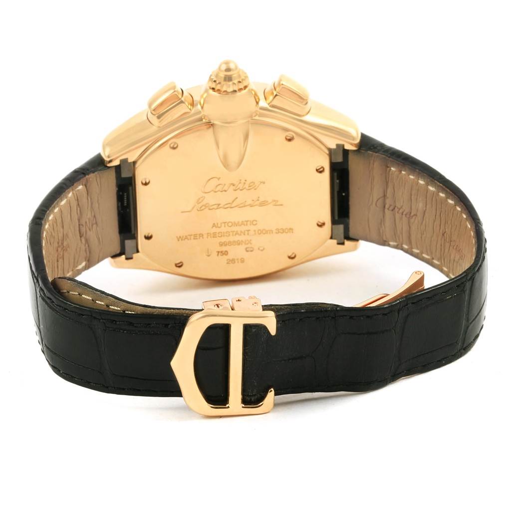 The image shows the back of the Cartier Roadster W62021Y3 Men's Yellow Gold Silver Dial W62021Y3 Men's Yellow Gold Silver Dial watch, highlighting the casing, leather strap, and clasp.