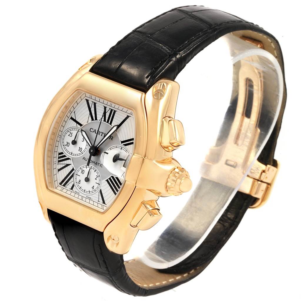 The image shows a Cartier Roadster W62021Y3 Men's Yellow Gold Silver Dial W62021Y3 Men's Yellow Gold Silver Dial watch from an angled side view, displaying its face, dial, crown, and leather strap.