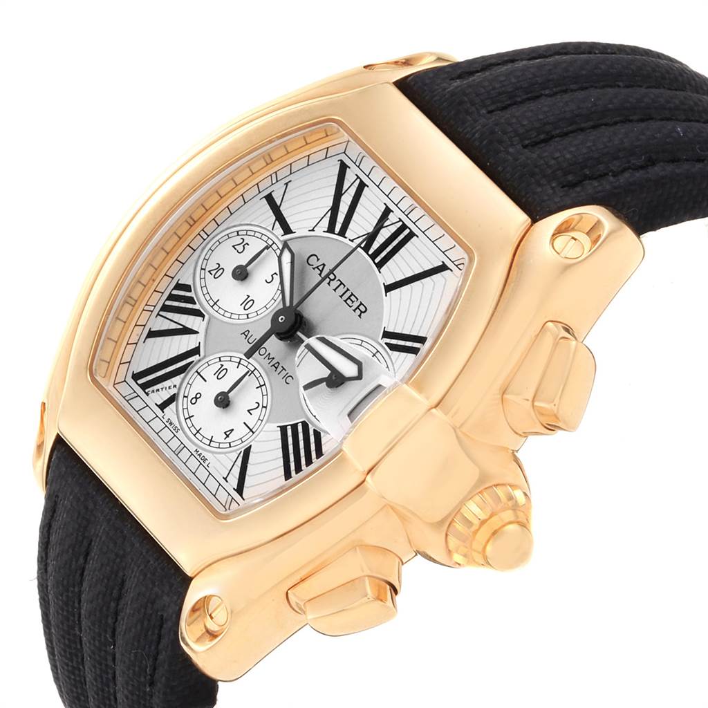 The image shows a Cartier Roadster W62021Y3 Men's Yellow Gold Silver Dial W62021Y3 Men's Yellow Gold Silver Dial watch at a slight angle, highlighting its gold case, black strap, and chronograph details.
