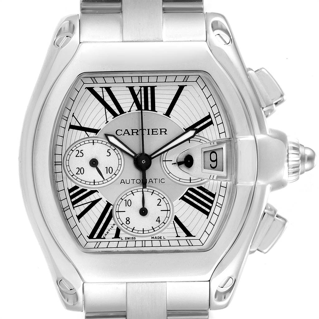 The image shows a close-up frontal view of the Cartier Roadster W62019X6 Men's Stainless Steel Silver Dial W62019X6 Men's Stainless Steel Silver Dial watch, displaying its dial, hands, subdials, and date window.