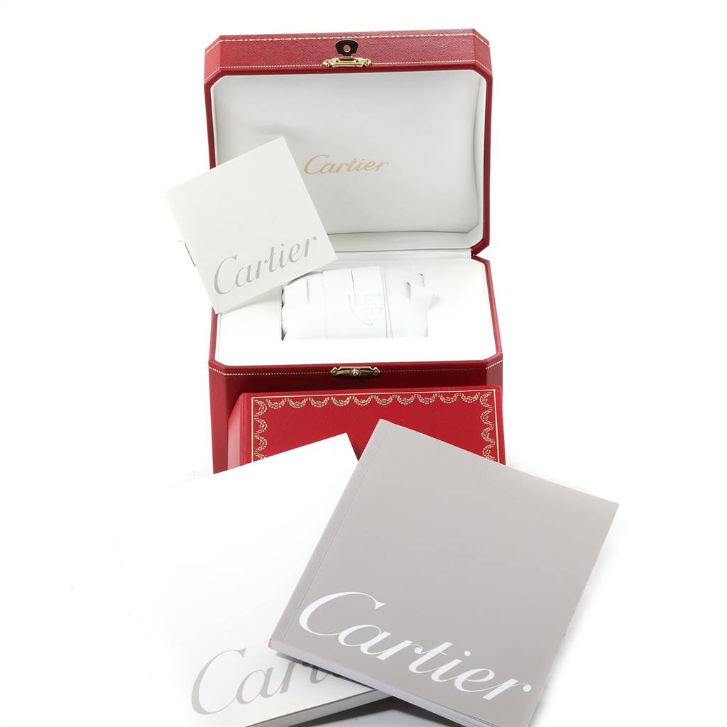 The image shows a Cartier Roadster W62005V2 Men's Yellow Gold Silver Dial W62005V2 Men's Yellow Gold Silver Dial watch box and accessories, including the branded packaging and booklets.