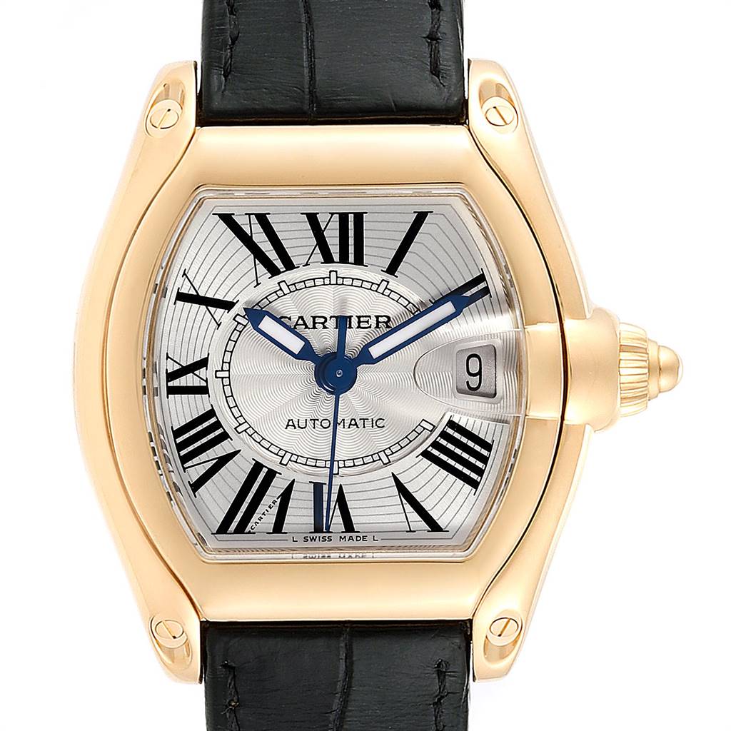 This image shows a close-up, front view of the Cartier Roadster W62005V2 Men's Yellow Gold Silver Dial W62005V2 Men's Yellow Gold Silver Dial watch, highlighting the face, crown, and part of the strap.