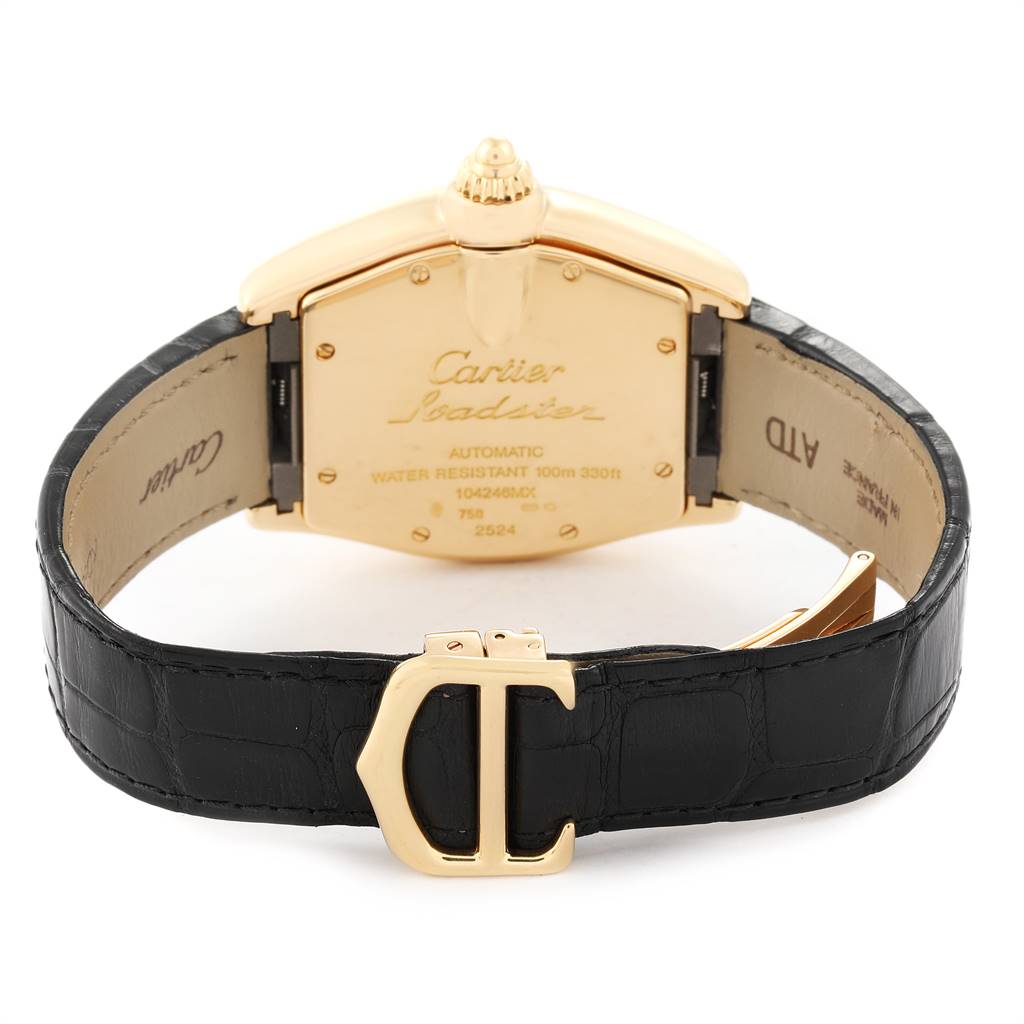 The image shows the back view of a Cartier Roadster W62005V2 Men's Yellow Gold Silver Dial W62005V2 Men's Yellow Gold Silver Dial watch, highlighting its case back, crown, and black leather strap.