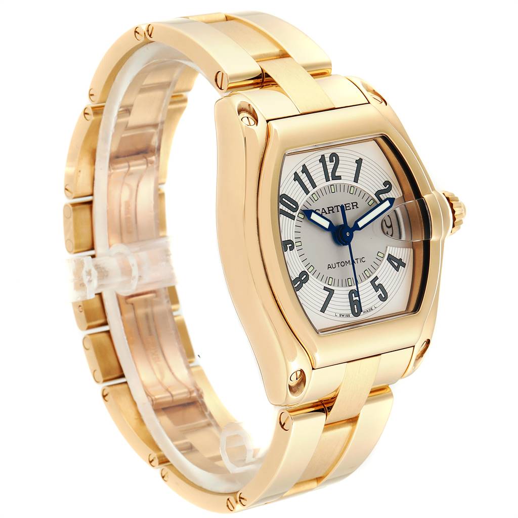 The image shows the Cartier Roadster W62005V1 Men's Yellow Gold Silver Dial W62005V1 Men's Yellow Gold Silver Dial watch at a three-quarter angle, displaying its face, case, and gold bracelet.