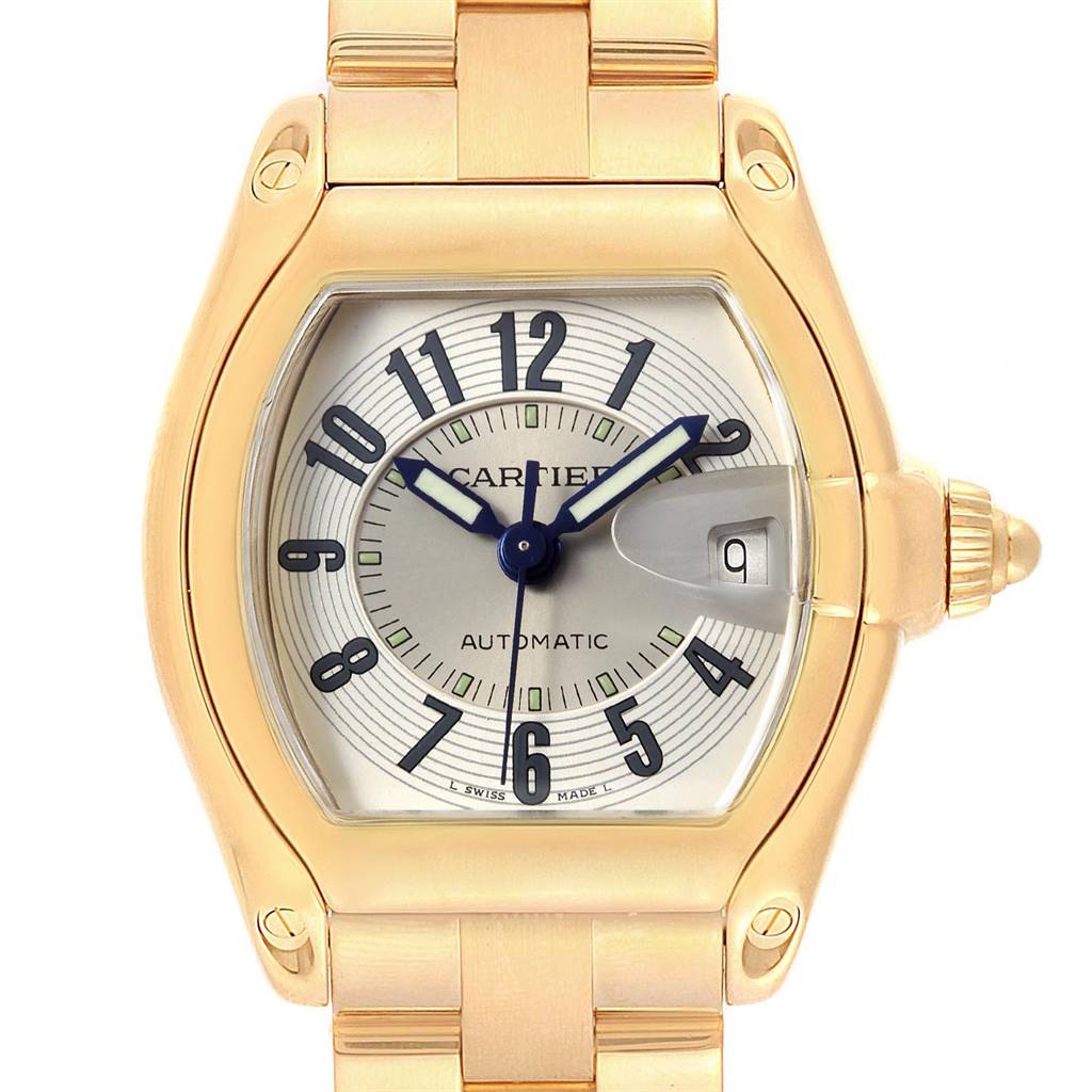 This image shows a close-up of the Cartier Roadster W62005V1 Men's Yellow Gold Silver Dial W62005V1 Men's Yellow Gold Silver Dial watch, highlighting the face, bezel, and part of the bracelet.