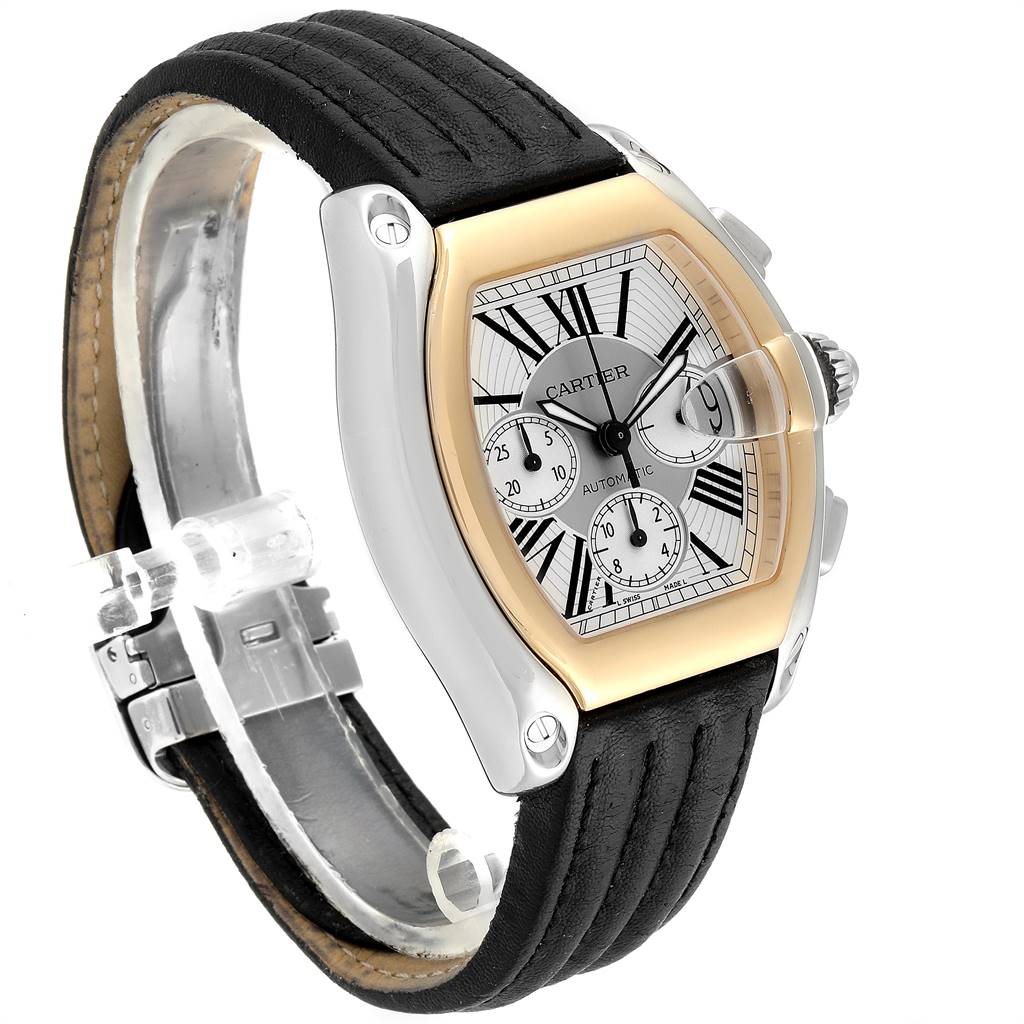The Cartier Roadster W62027Z1 Men
s Steel and Gold (two tone) Silver Dial W62027Z1 Men
s Steel and Gold (two tone) Silver Dial watch is shown at an angle, highlighting its face, bezel, crown, and leather strap.