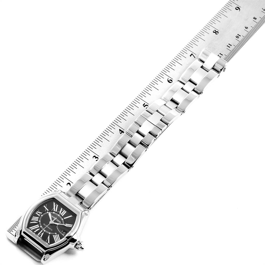 The image shows a Cartier Roadster W62041V3 Men's Stainless Steel Black Dial W62041V3 Men's Stainless Steel Black Dial watch laid flat with its bracelet measured against a ruler for length.