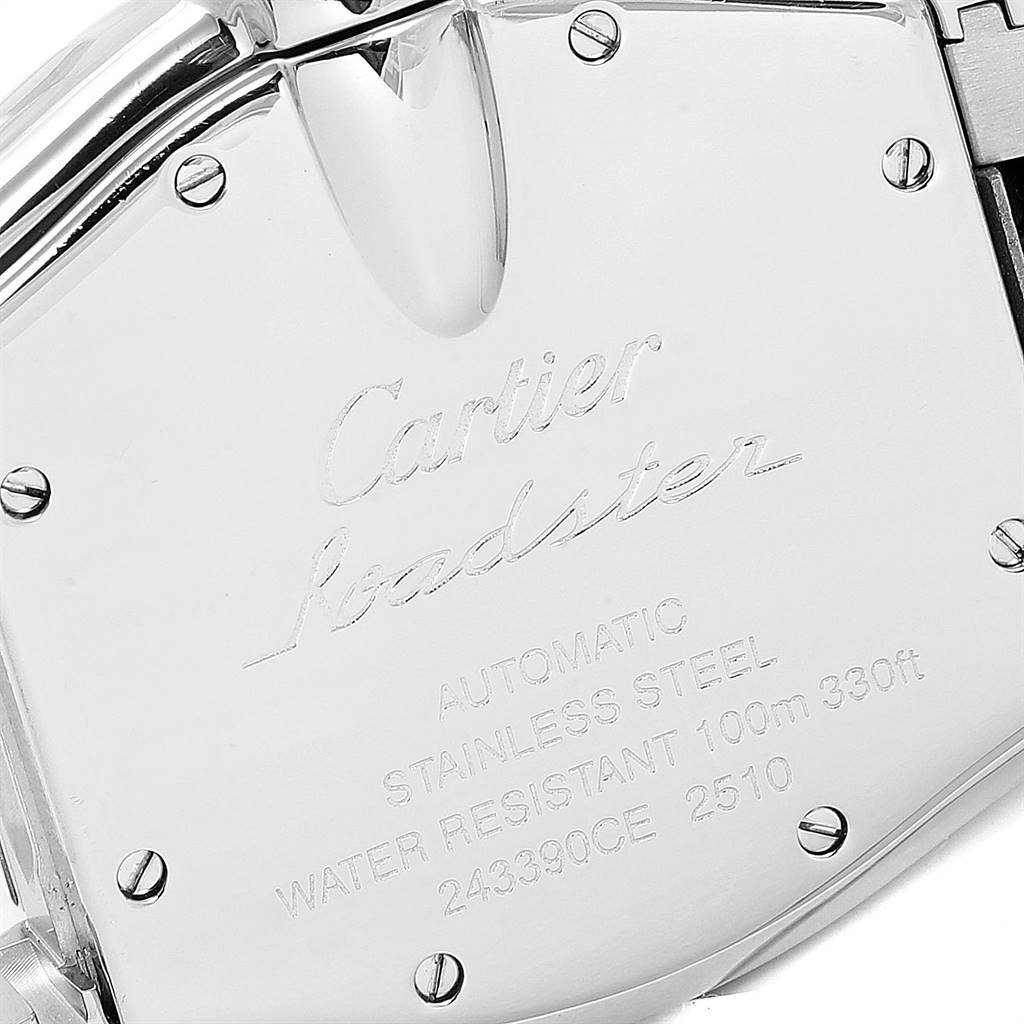 The image shows the back case of a Cartier Roadster W62041V3 Men's Stainless Steel Black Dial W62041V3 Men's Stainless Steel Black Dial watch, featuring engraved text and screws.