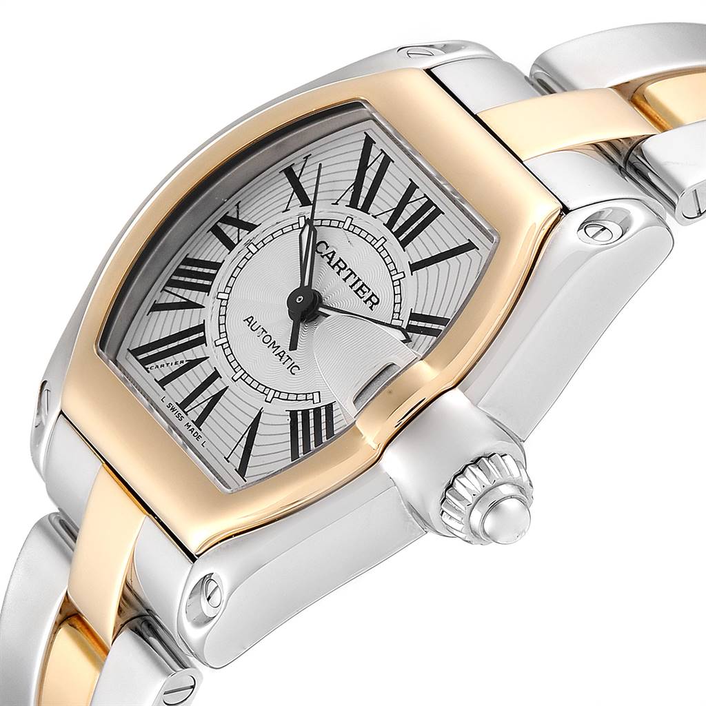 The image shows the dial, bezel, crown, and part of the bracelet of a Cartier Roadster W62031Y4 Men's Steel and Gold (two tone) Silver Dial W62031Y4 Men's Steel and Gold (two tone) Silver Dial watch at an angled view.