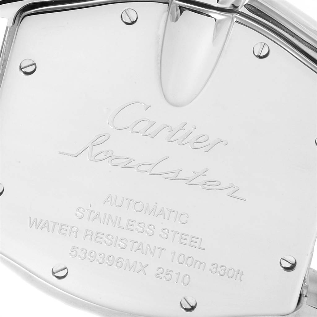 The image shows the back casing of a Cartier Roadster W62025V3 Men's Stainless Steel Silver Dial W62025V3 Men's Stainless Steel Silver Dial watch, angled to display the engraved details and screws.