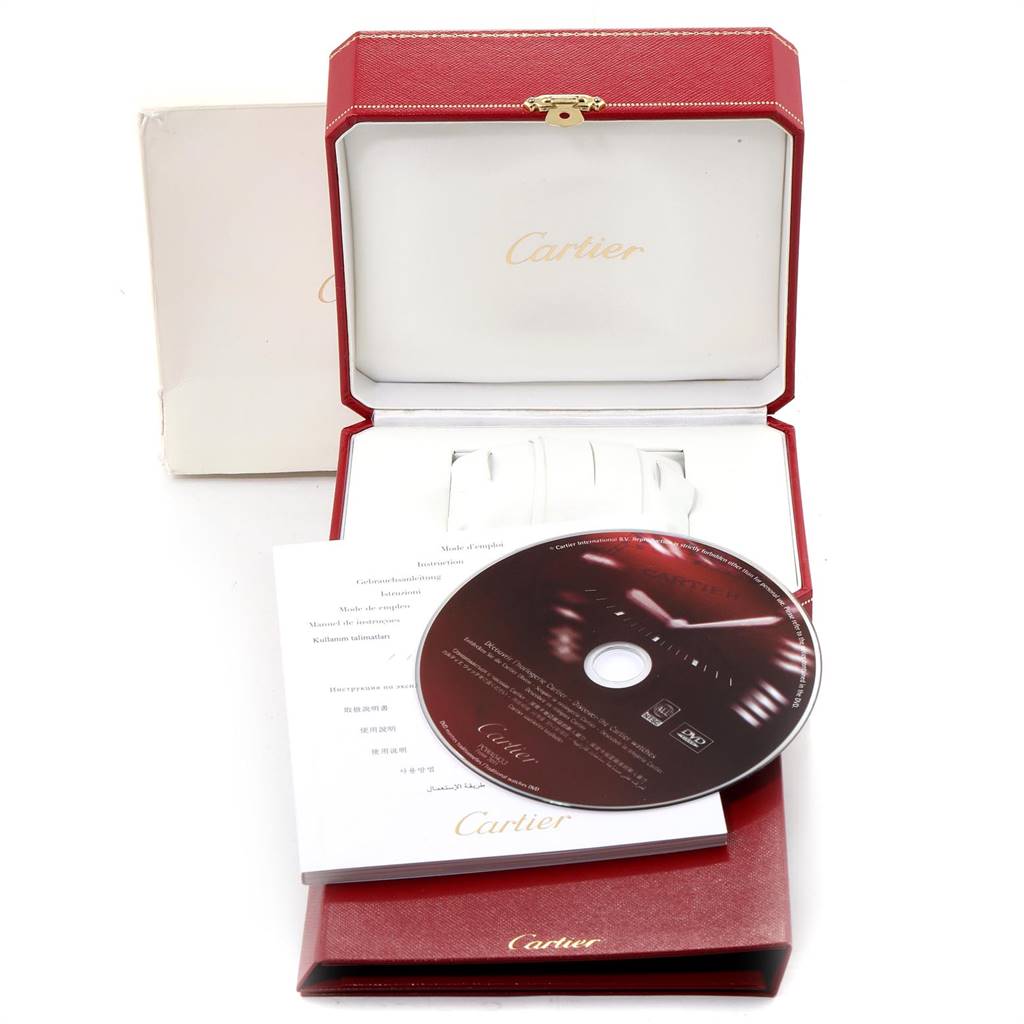 The image shows an open red Cartier watch box for the Roadster model, with a DVD and manuals beside it.