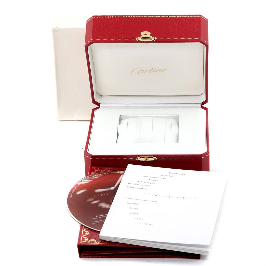 The image shows the packaging and accessories, including a box, manual, and CD, for the Roadster model by Cartier.