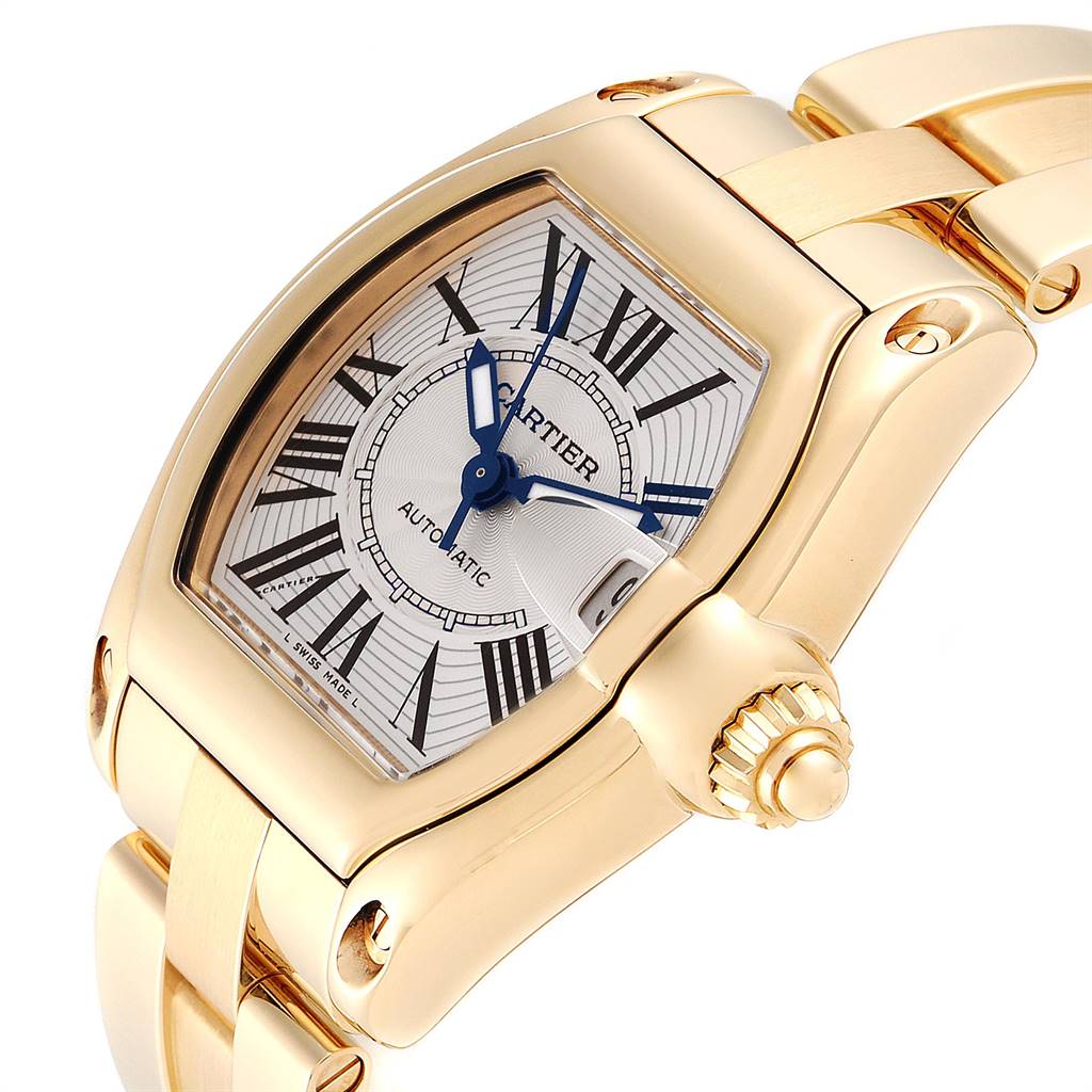 This image shows a close-up angle of the face and part of the bracelet of a Cartier Roadster W62005V2 Men's Yellow Gold Silver Dial W62005V2 Men's Yellow Gold Silver Dial watch.