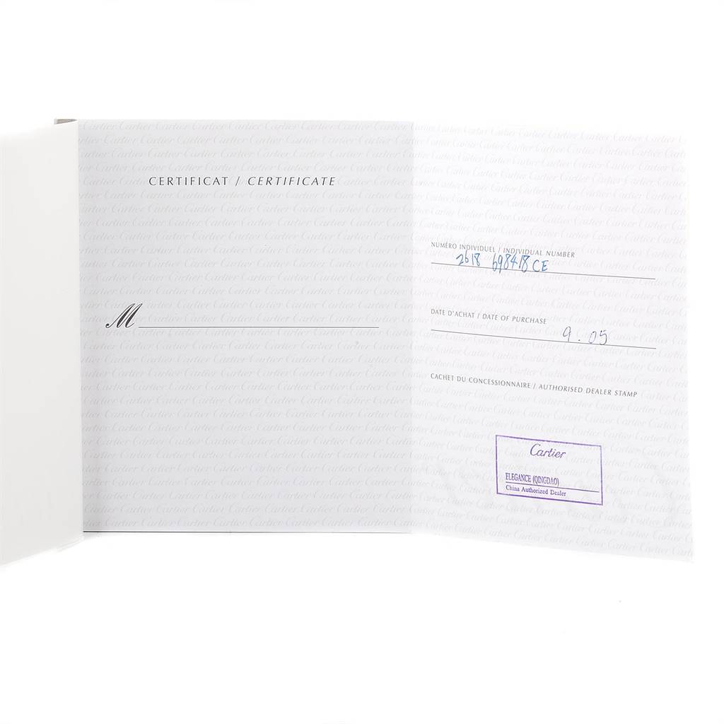 This image shows the open instruction manual and certification card for the Cartier Roadster W62020X6 Men
s Stainless Steel Black Dial W62020X6 Men
s Stainless Steel Black Dial watch.