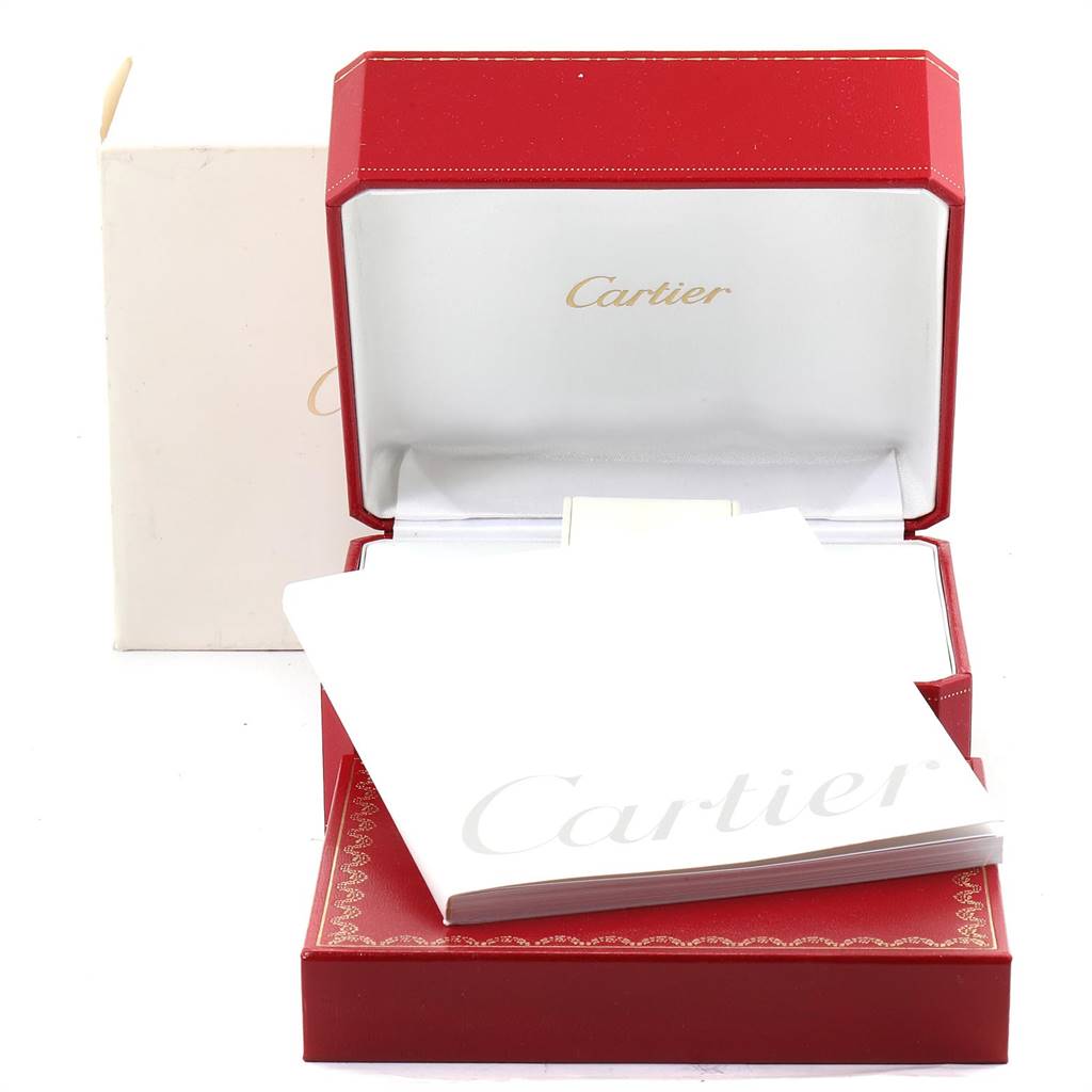 The image shows an open red Cartier box with a booklet, presumably for the Roadster model by Cartier, displayed in front.