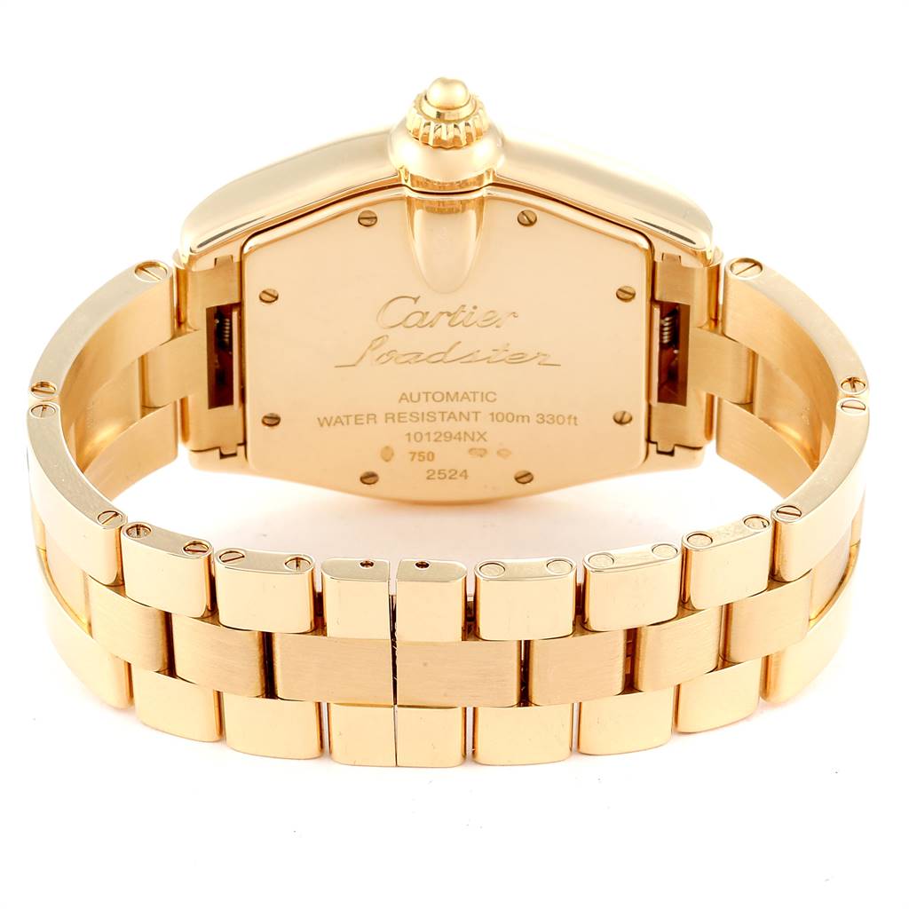 The image shows the back and bracelet of a Cartier Roadster W62005V1 Men's Yellow Gold Silver Dial W62005V1 Men's Yellow Gold Silver Dial watch, featuring its caseback details and crown.