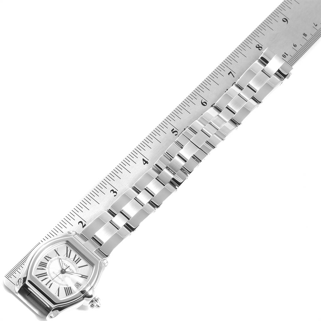 This image shows a Cartier Roadster W62025V3 Men
s Stainless Steel Silver Dial W62025V3 Men
s Stainless Steel Silver Dial watch straight link bracelet aligned with a ruler.