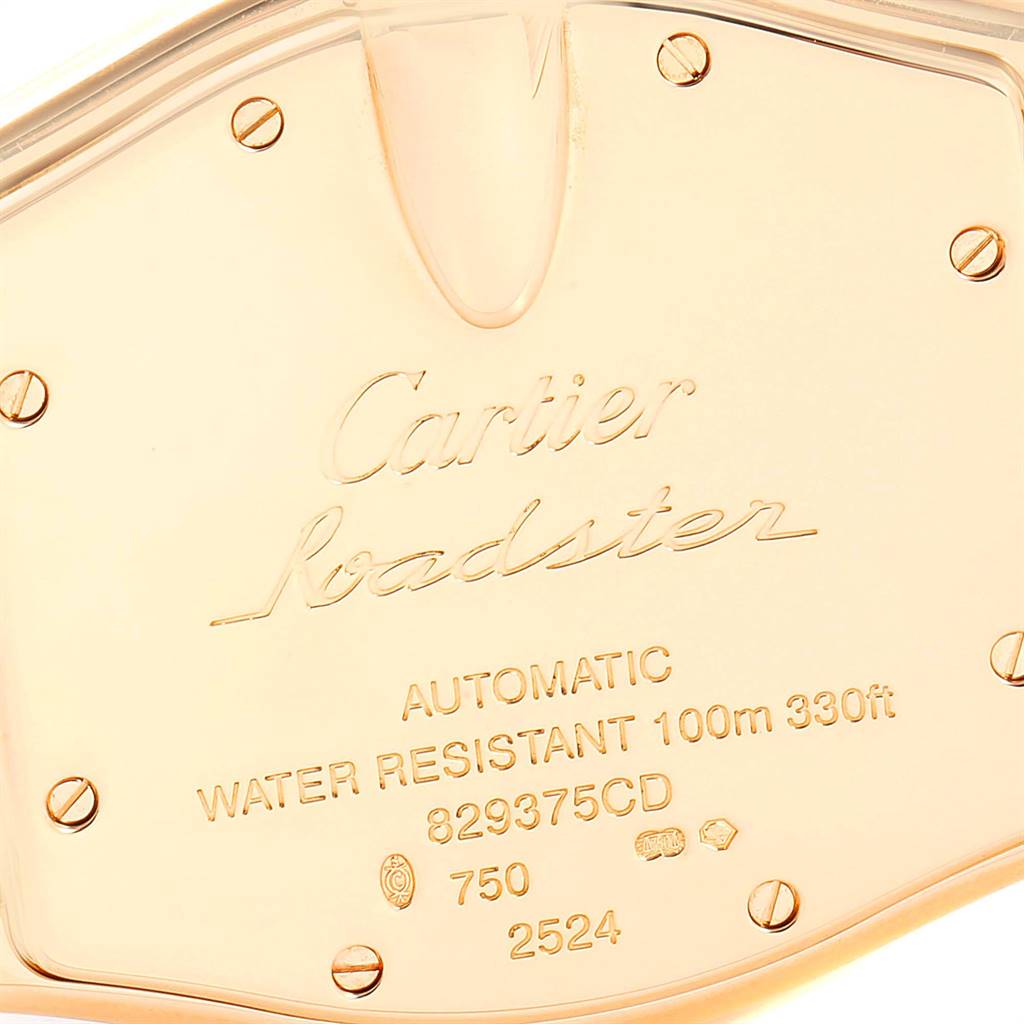 The image shows the case back of a Cartier Roadster W62003V1 Men
s Yellow Gold Silver Dial W62003V1 Men
s Yellow Gold Silver Dial watch, displaying engraved details and screws.