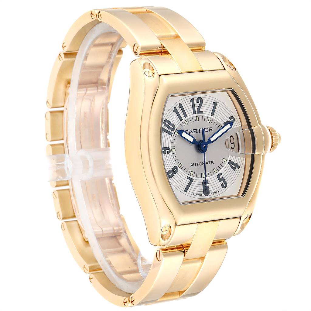 This image shows a Cartier Roadster W62003V1 Men
s Yellow Gold Silver Dial W62003V1 Men
s Yellow Gold Silver Dial watch from a three-quarter angle, highlighting its gold bracelet, watch face, and crown.