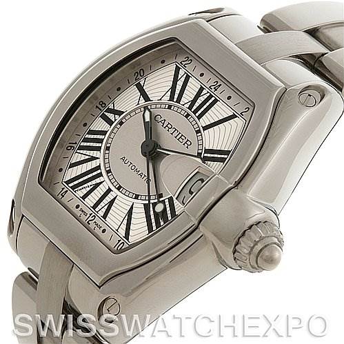 This image shows a close-up of a Cartier Roadster W62032X6 Men's Stainless Steel Silver Dial W62032X6 Men's Stainless Steel Silver Dial watch, focusing on the dial, case, and crown from an angled perspective.