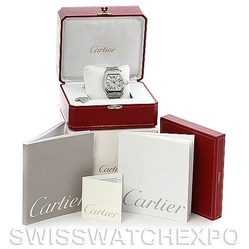 The Cartier Roadster W62032X6 Men's Stainless Steel Silver Dial W62032X6 Men's Stainless Steel Silver Dial watch is displayed in an open red case along with its accessories, manuals, and additional boxes.
