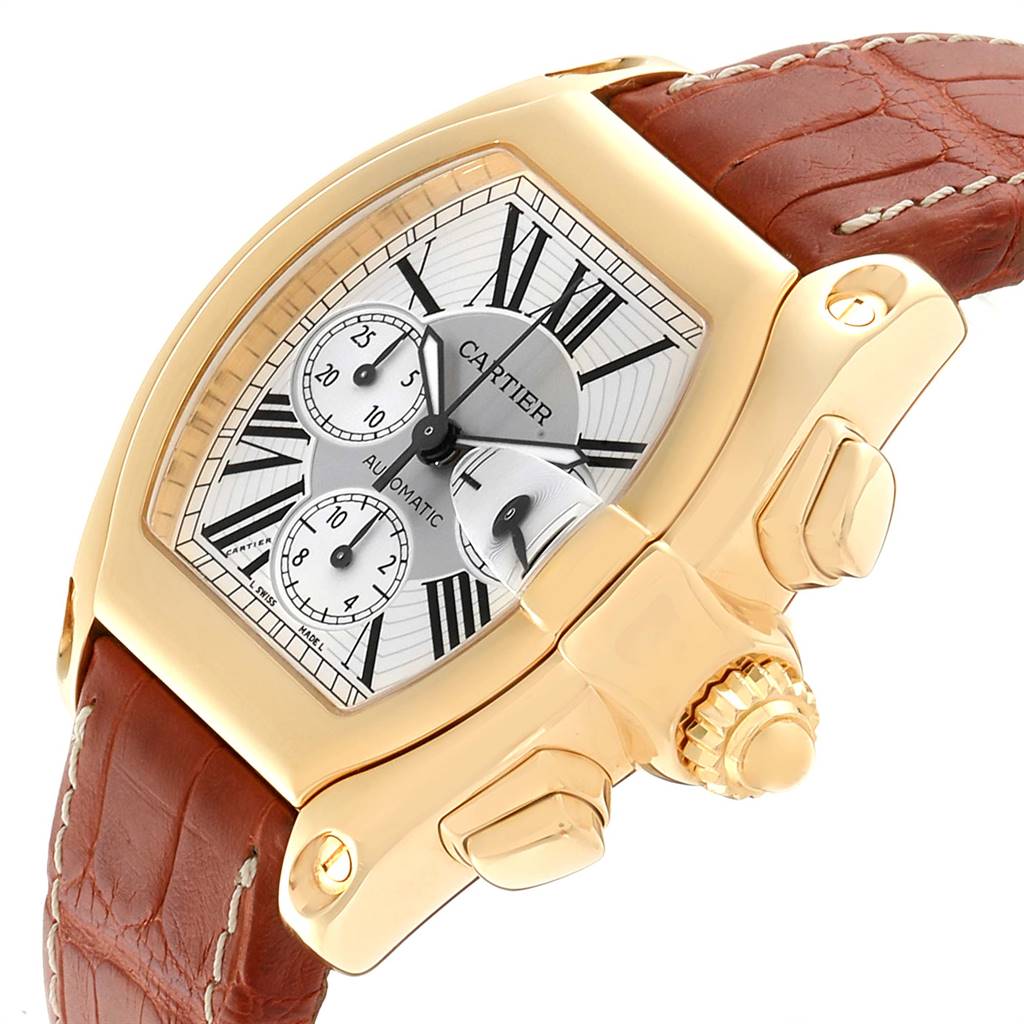 This image shows a close-up side angle of the Cartier Roadster W62021Y3 Men's Yellow Gold Silver Dial W62021Y3 Men's Yellow Gold Silver Dial watch, highlighting the dial, crown, and part of the leather strap.