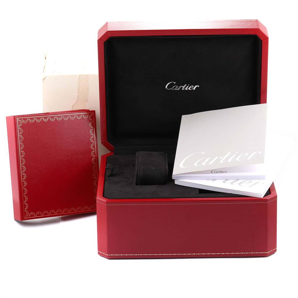 The image shows the packaging and accessories for a Cartier Roadster W62021Y3 Men's Yellow Gold Silver Dial W62021Y3 Men's Yellow Gold Silver Dial watch, including a red box and manuals.