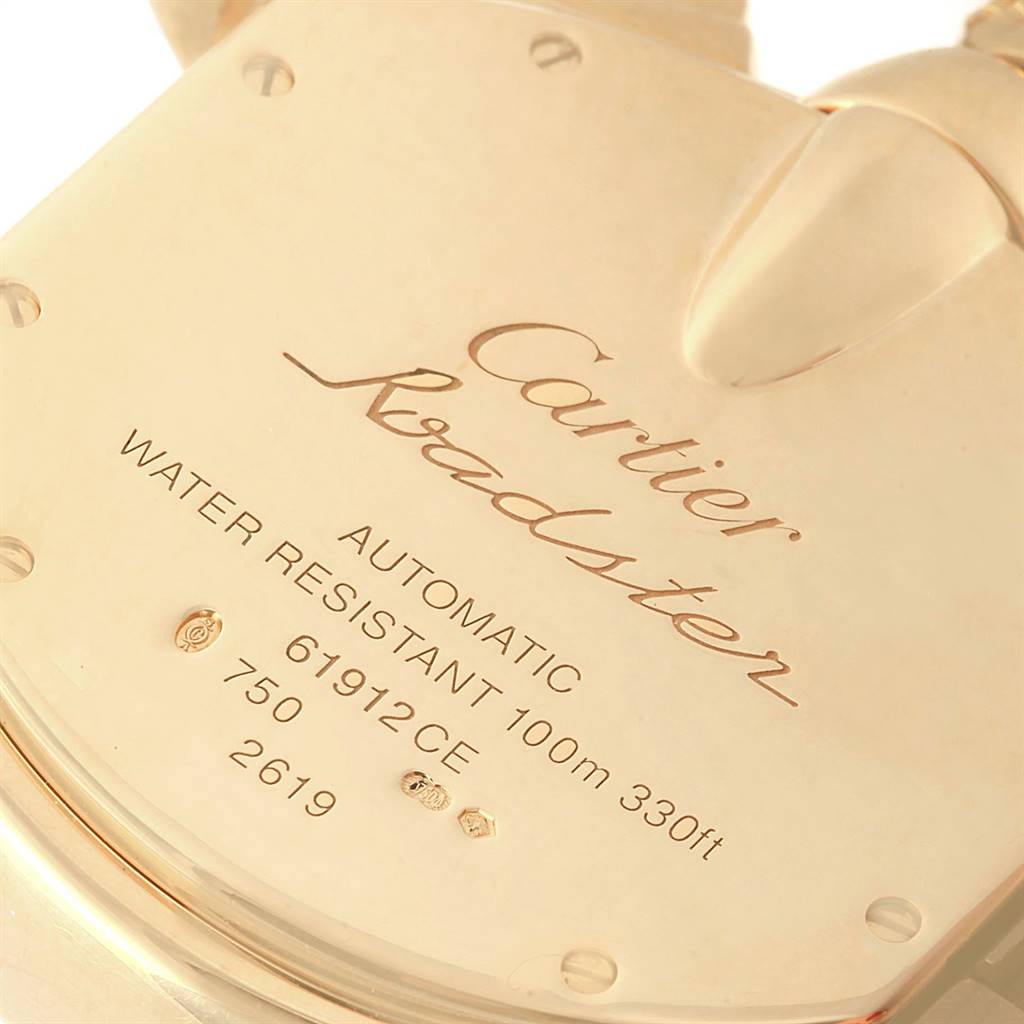 The image shows the back case of a Cartier Roadster W62021Y3 Men's Yellow Gold Silver Dial W62021Y3 Men's Yellow Gold Silver Dial watch, highlighting the inscriptions and water resistance specifications.