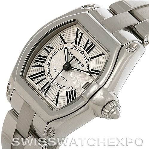 The image shows a Cartier Roadster W62025V3 Men's Stainless Steel Silver Dial W62025V3 Men's Stainless Steel Silver Dial watch from an angled side view, highlighting its face, crown, and part of the metal bracelet.