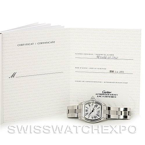 The image shows a Cartier Roadster W62025V3 Men's Stainless Steel Silver Dial W62025V3 Men's Stainless Steel Silver Dial watch and its accompanying certification documents.