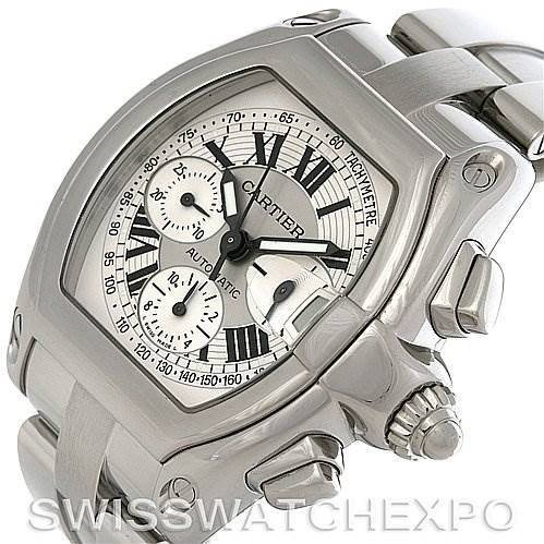 The image shows a Cartier Roadster W62019X6 Men's Stainless Steel Silver Dial W62019X6 Men's Stainless Steel Silver Dial watch at an angled view, highlighting the dial, crown, and stainless steel bracelet.