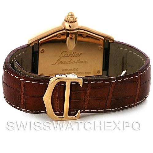 The image shows the back of a Cartier Roadster W62005V2 Men's Yellow Gold Silver Dial W62005V2 Men's Yellow Gold Silver Dial watch, highlighting the case back, leather strap, and "C" clasp.