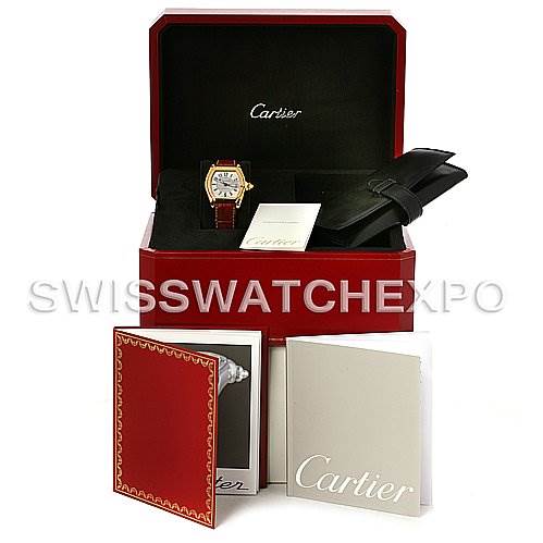 The image shows a Cartier Roadster W62005V2 Men's Yellow Gold Silver Dial W62005V2 Men's Yellow Gold Silver Dial watch, box, manuals, and accessories photographed from a front angle.
