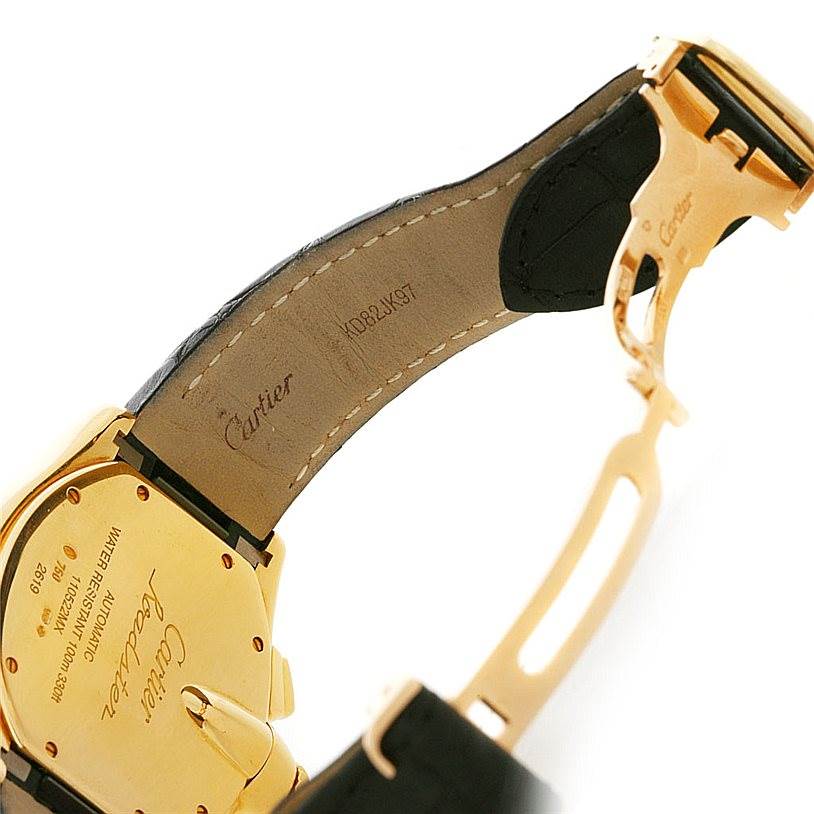 This image shows the underside of a Cartier Roadster W62021Y2 Men's Yellow Gold Silver Dial W62021Y2 Men's Yellow Gold Silver Dial watch, highlighting the back case, leather strap, and deployment clasp.