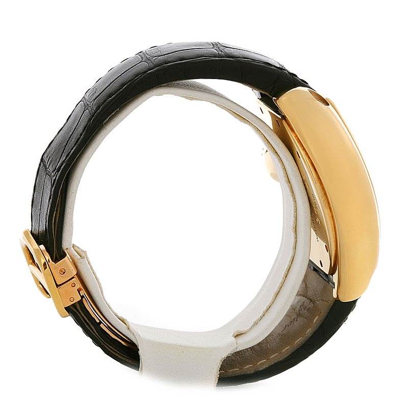 The image shows the side profile of a Cartier Roadster W62021Y2 Men's Yellow Gold Silver Dial W62021Y2 Men's Yellow Gold Silver Dial watch, focusing on its black strap and gold case.