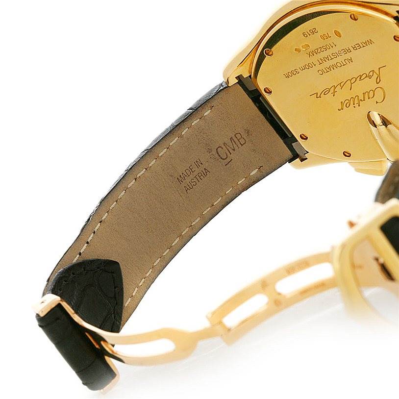 The image shows the side angle of a Cartier Roadster W62021Y2 Men's Yellow Gold Silver Dial W62021Y2 Men's Yellow Gold Silver Dial watch, focusing on its leather strap, deployment clasp, and case back.