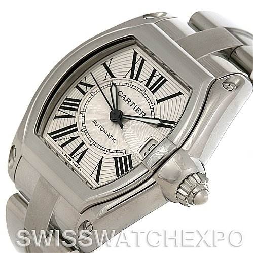 The image shows a Cartier Roadster W62025V3 Men's Stainless Steel Silver Dial W62025V3 Men's Stainless Steel Silver Dial watch focusing on the case, bezel, dial, bracelet, and crown from an angled side view.