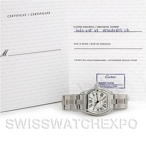 The Cartier Roadster W62025V3 Men's Stainless Steel Silver Dial W62025V3 Men's Stainless Steel Silver Dial watch is shown from a front angle, alongside a certificate of authenticity.