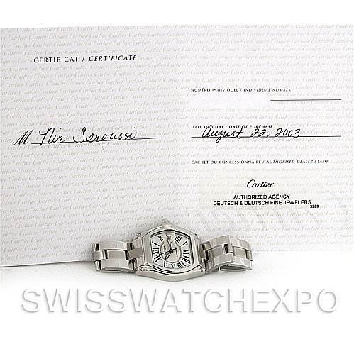 The image shows a Cartier Roadster W62025V3 Men
s Stainless Steel Silver Dial W62025V3 Men
s Stainless Steel Silver Dial watch seen from the front along with its certificate of purchase and warranty paper.