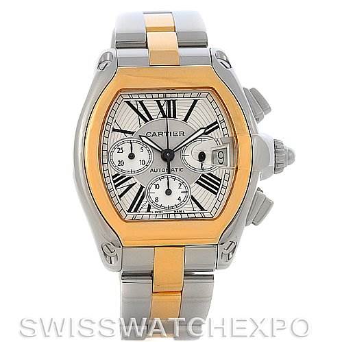 The image shows a head-on view of a Cartier Roadster W62027Z1 Men's Steel and Gold (two tone) Silver Dial W62027Z1 Men's Steel and Gold (two tone) Silver Dial watch, displaying its dial, date window, and polished two-tone steel band.