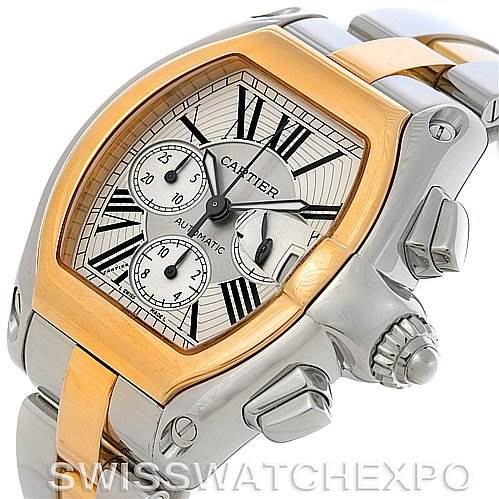 The image shows a close-up of a Cartier Roadster W62027Z1 Men's Steel and Gold (two tone) Silver Dial W62027Z1 Men's Steel and Gold (two tone) Silver Dial watch from an angled view highlighting the dial and side buttons.
