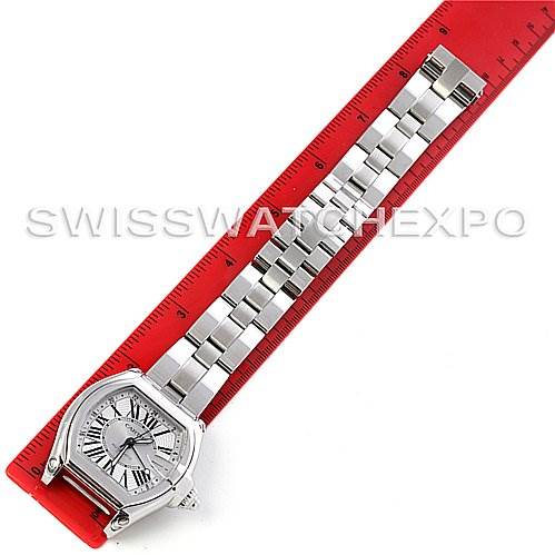 This image shows the face and metal bracelet of a Cartier Roadster W62032X6 Men's Stainless Steel Silver Dial W62032X6 Men's Stainless Steel Silver Dial watch, displayed next to a red ruler for scale.